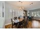 Elegant dining room featuring wood floors and a view of the bar at 64 Chateau Whistler Ct, Las Vegas, NV 89148