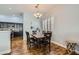 Dining room with a wooden table, seating for six, and wood floors at 64 Chateau Whistler Ct, Las Vegas, NV 89148