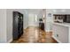 Inviting entryway with wood floors leading to the kitchen with sleek countertop at 64 Chateau Whistler Ct, Las Vegas, NV 89148