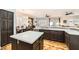 Spacious kitchen includes an island, stainless steel appliances, wood floors, and breakfast nook at 64 Chateau Whistler Ct, Las Vegas, NV 89148