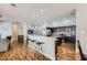 Open kitchen features a breakfast bar with seating and dark cabinetry at 64 Chateau Whistler Ct, Las Vegas, NV 89148