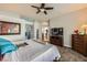 A spacious main bedroom with a ceiling fan and a walk-in closet at 64 Chateau Whistler Ct, Las Vegas, NV 89148