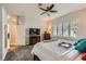 Primary bedroom with ceiling fan, shutters and access to ensuite bathroom at 64 Chateau Whistler Ct, Las Vegas, NV 89148