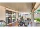 Beautiful covered patio area with comfortable seating and a sliding glass door at 64 Chateau Whistler Ct, Las Vegas, NV 89148