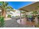 Outdoor patio area featuring a covered space, landscaping, and seating at 64 Chateau Whistler Ct, Las Vegas, NV 89148