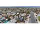 Neighborhood aerial view shows the layout with mature trees and residential streets at 6401 Goldmine Dr, Las Vegas, NV 89156