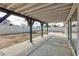 Covered back patio with concrete flooring and access to backyard at 6401 Goldmine Dr, Las Vegas, NV 89156