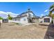 Expansive backyard featuring a two-story home with a balcony and detached garage at 6401 Goldmine Dr, Las Vegas, NV 89156