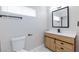 Bathroom features a modern vanity with drawers, a new mirror and fixtures at 6401 Goldmine Dr, Las Vegas, NV 89156