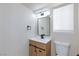 Modern bathroom featuring a new vanity, stylish mirror, and bright lighting at 6401 Goldmine Dr, Las Vegas, NV 89156
