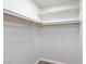 Spacious closet with ample storage space, featuring multiple shelves and hanging rods at 6401 Goldmine Dr, Las Vegas, NV 89156