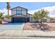 Charming two-story home featuring a well-maintained yard and a two-car garage at 6401 Goldmine Dr, Las Vegas, NV 89156