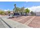 Lovely two-story home with a landscaped front yard and an extended driveway for extra parking at 6401 Goldmine Dr, Las Vegas, NV 89156