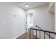 Upstairs hallway with access to bedrooms and a bathroom at 6401 Goldmine Dr, Las Vegas, NV 89156
