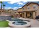 Picturesque backyard features a pool, spa, lush lawn, and covered patio, perfect for outdoor enjoyment at 651 Penshaw Bridge Ave, Las Vegas, NV 89178