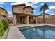 Inviting backyard pool with covered patio, perfect for outdoor entertaining and relaxation under the sunny skies at 651 Penshaw Bridge Ave, Las Vegas, NV 89178