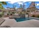 Serene backyard features a sparkling pool, spa, lush landscaping, and sunshade, ideal for relaxation at 651 Penshaw Bridge Ave, Las Vegas, NV 89178