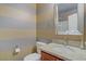 Bathroom featuring striped wall pattern, granite counter and vanity at 651 Penshaw Bridge Ave, Las Vegas, NV 89178