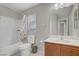 Bright bathroom with a vanity, shower-tub combination, and neutral finishes at 651 Penshaw Bridge Ave, Las Vegas, NV 89178