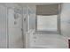 Primary bathroom featuring a separate tub and shower and stylish window treatment at 651 Penshaw Bridge Ave, Las Vegas, NV 89178