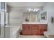 Bright primary bathroom featuring double sinks, large mirror, and stylish cabinets at 651 Penshaw Bridge Ave, Las Vegas, NV 89178