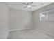 Carpeted bedroom with a ceiling fan and window allowing natural light at 651 Penshaw Bridge Ave, Las Vegas, NV 89178