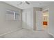 Bedroom offers carpet floors, a ceiling fan, closet doors, and a window with blinds at 651 Penshaw Bridge Ave, Las Vegas, NV 89178