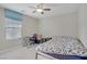 Neutral bedroom featuring a ceiling fan, window, and comfortable bed at 651 Penshaw Bridge Ave, Las Vegas, NV 89178