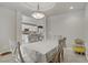 Inviting dining area adjacent to kitchen features a tray ceiling and natural light at 651 Penshaw Bridge Ave, Las Vegas, NV 89178