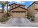 Beautiful two-story home with a two-car garage and desert landscaping at 651 Penshaw Bridge Ave, Las Vegas, NV 89178
