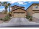 Charming two-story home with a two-car garage and desert landscaping at 651 Penshaw Bridge Ave, Las Vegas, NV 89178
