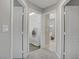 Hallway leads to a laundry room and bathroom, showcasing practical home design at 651 Penshaw Bridge Ave, Las Vegas, NV 89178