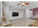 Inviting living area featuring tile flooring, built-in shelving, and ample natural light at 651 Penshaw Bridge Ave, Las Vegas, NV 89178