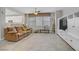 Spacious living room with a large TV entertainment center and tile floors at 651 Penshaw Bridge Ave, Las Vegas, NV 89178