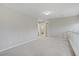 Spacious loft area featuring neutral walls and carpet with open access to adjacent rooms at 651 Penshaw Bridge Ave, Las Vegas, NV 89178