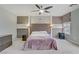 Spacious main bedroom featuring stylish ceiling fan, large window, and carpeted floor at 651 Penshaw Bridge Ave, Las Vegas, NV 89178