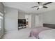 Spacious main bedroom featuring stylish ceiling fan, large window, and carpeted floor at 651 Penshaw Bridge Ave, Las Vegas, NV 89178