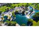 An aerial view of the community park, featuring water features and mature trees at 6917 Puetollano Dr, North Las Vegas, NV 89084