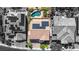 Aerial view of home, pool, and solar panels on the roof at 6917 Puetollano Dr, North Las Vegas, NV 89084