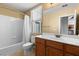 Bathroom featuring a shower-tub combination, neutral color palette, and bright lighting at 6917 Puetollano Dr, North Las Vegas, NV 89084