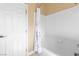 Well-lit bathroom with bright white tiled shower and neutral paint offers comfortable living at 6917 Puetollano Dr, North Las Vegas, NV 89084