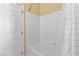 Bright bathroom featuring white tiled shower and neutral paint offers comfortable living at 6917 Puetollano Dr, North Las Vegas, NV 89084