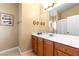 Well-lit bathroom with spacious vanity, bright window, and neutral paint at 6917 Puetollano Dr, North Las Vegas, NV 89084