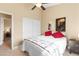 Cozy bedroom with adjacent closet, bright window, and neutral color scheme offers comfortable living at 6917 Puetollano Dr, North Las Vegas, NV 89084