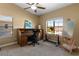 Spacious bedroom with ample workspace, bright windows, and neutral color palette at 6917 Puetollano Dr, North Las Vegas, NV 89084