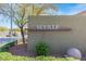 The Seville community entrance featuring attractive desert landscaping at 6917 Puetollano Dr, North Las Vegas, NV 89084