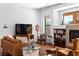 Inviting living room with stylish furnishings and fireplace; perfect for relaxation at 6917 Puetollano Dr, North Las Vegas, NV 89084