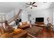 Spacious living room with hardwood floors, staircase, and comfortable seating at 6917 Puetollano Dr, North Las Vegas, NV 89084