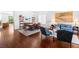 Spacious living and dining area with hardwood floors, elegant furniture, and a bright, airy feel at 6917 Puetollano Dr, North Las Vegas, NV 89084