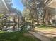 Scenic backyard view overlooking a tranquil pond, surrounded by lush greenery and serene landscaping at 6987 Emerald Springs Ln, Las Vegas, NV 89113